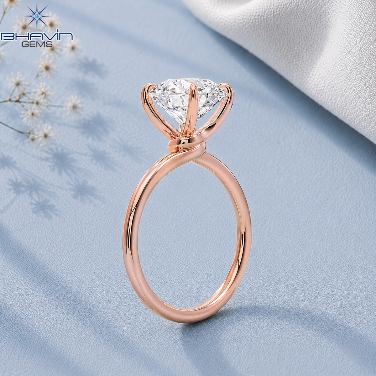 Eterna Round Cut Solitaire Ring with Elegant Sculpted Prong Setting