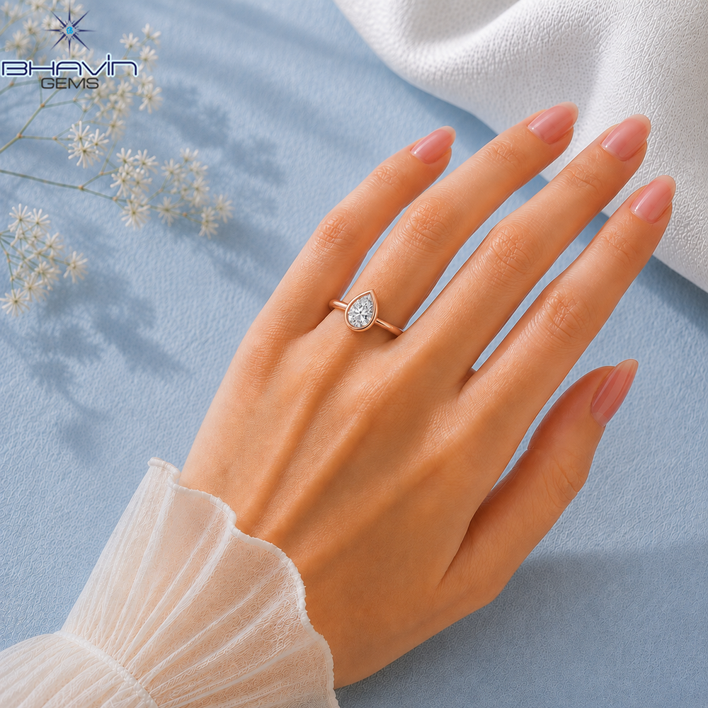 Pear Cut Bezel Set Solitaire Engagement Ring in Rose Gold
